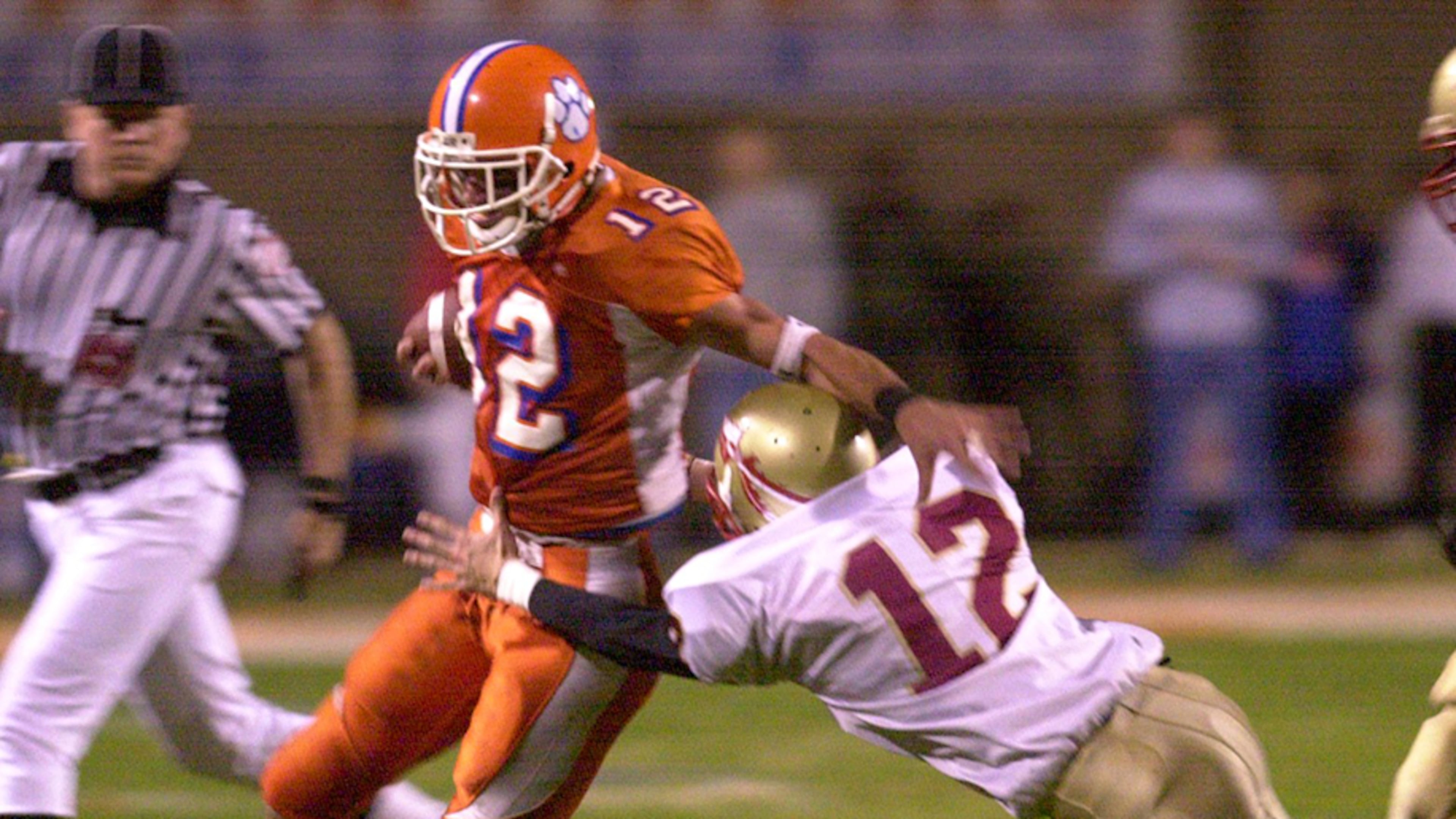 Parkview's Jeff Francoeur gives a stiff-arm to Westside Macon defender John Clark in 2001 quarterfinal playoff action. (AJC File)