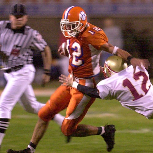 Parkview's Jeff Francoeur gives a stiff-arm to Westside Macon defender John Clark in 2001 quarterfinal playoff action. (AJC File)
