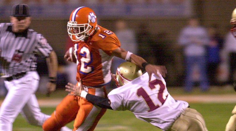Parkview's Jeff Francoeur gives a stiff-arm to Westside Macon defender John Clark in 2001 quarterfinal playoff action. (AJC File)