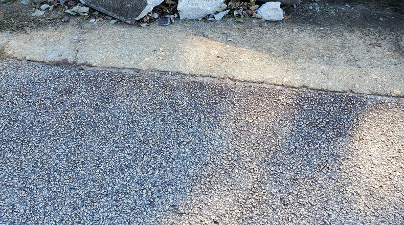 Diane Dane wants this crumbling pavement fixed.