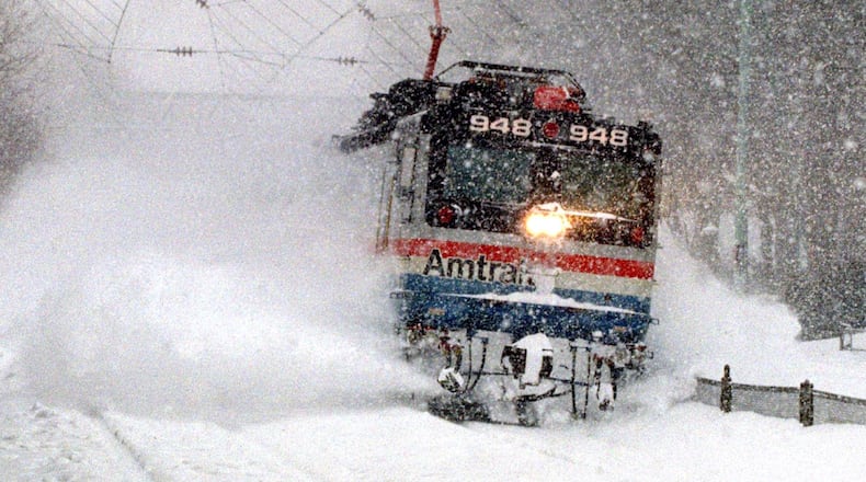 UNITED STATES - JANUARY 12:  An Amtrak train blasts through a snow drift, as it runs through Wynnewood, Pa., en route from Harrisburg to Philadelphia.  (Photo by Harry Hamburg/NY Daily News Archive via Getty Images)