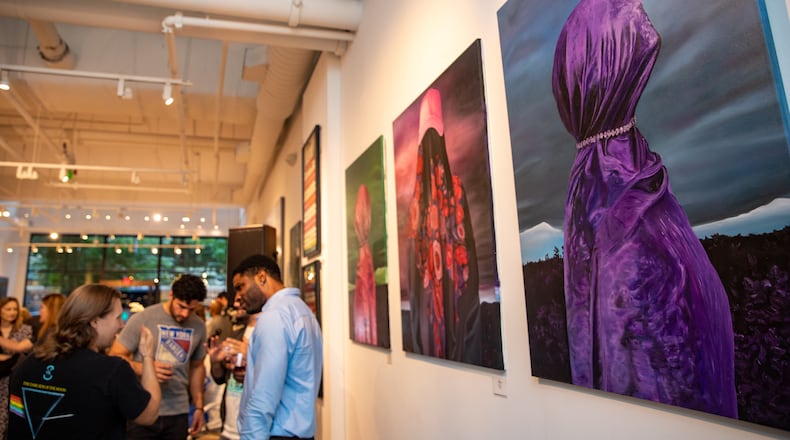 The exhibit titled, “Ukranian Art Collection,” which features 30 contemporary works by 13 artists, is on display at Buckhead Art Company through June 17. A private reception celebrating the opening of the art show was held on Thursday. (Jenni Girtman for The Atlanta Journal-Constitution)