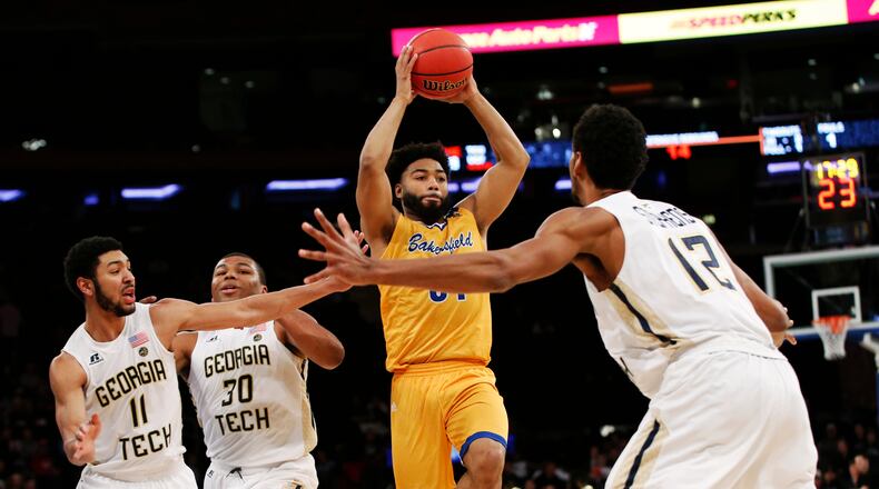 Cal State Bakersfield Justin Pride (51) looks to pass around the Georgia Tech defense during the second half of an NCAA college basketball game in the semifinals of the NIT Tuesday, March 28, 2017, in New York. (AP Photo/Kathy Willens)
