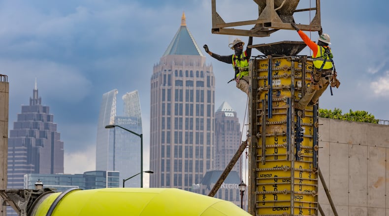 Workers prepare forms near 17th Street in West Midtown Atlanta on Wednesday, May 15, 2024, where Southeastern Development Brokerage Consulting is developing a mixed-use project called UrbA ATL which will have 321 luxury apartments and about 27,000 square feet of retail and restaurants. (John Spink/AJC)