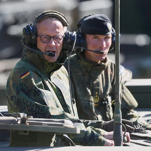German Chancellor Friedrich Merz drives in the armoured fighting vehicle Boxer during his visit to the army at the Bundeswehr base in Munster, Germany, Thursday, April, 30, 2026. (AP Photo/Markus Schreiber, Pool)
