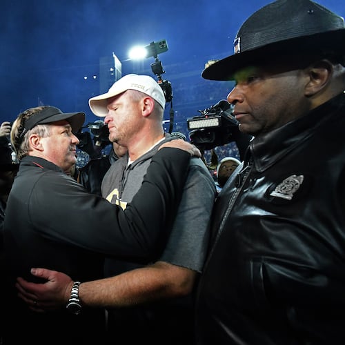 Georgia head coach Kirby Smart and Georgia Tech head coach Brent Key talk after Georgia won 44-42 over Georgia Tech in eight overtimes during an NCAA football game at Sanford Stadium, Friday, November 29, 2024, in Athens. (Hyosub Shin/AJC)