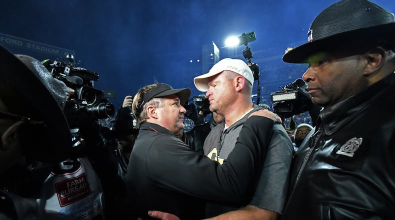 Georgia head coach Kirby Smart and Georgia Tech head coach Brent Key talk after Georgia won 44-42 over Georgia Tech in eight overtimes during an NCAA football game at Sanford Stadium, Friday, November 29, 2024, in Athens. (Hyosub Shin / AJC)