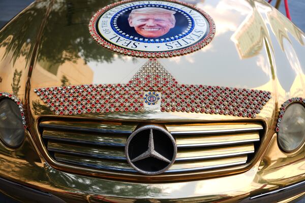 A Mercedes decorated with images of President Donald Trump is seen before the Republican midterm convention on Tuesday in Dallas. (Julia Demaree Nikhinson/AP)