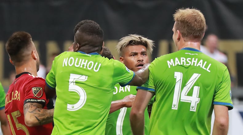 July 15, 2018 Atlanta: Atlanta United midfielder Josef Martinez gets into a scuffle with Seattle Sounders Chad Marshall during the first half in a MLS soccer game on Sunday, July 15, 2018, in Atlanta.     Curtis Compton/ccompton@ajc.com