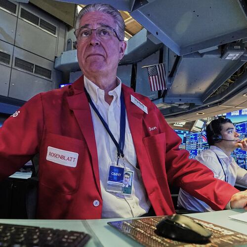 Trader Daniel Kryger, left, works on the floor of the New York Stock Exchange, Monday, June 15, 2026. (AP Photo/Richard Drew)