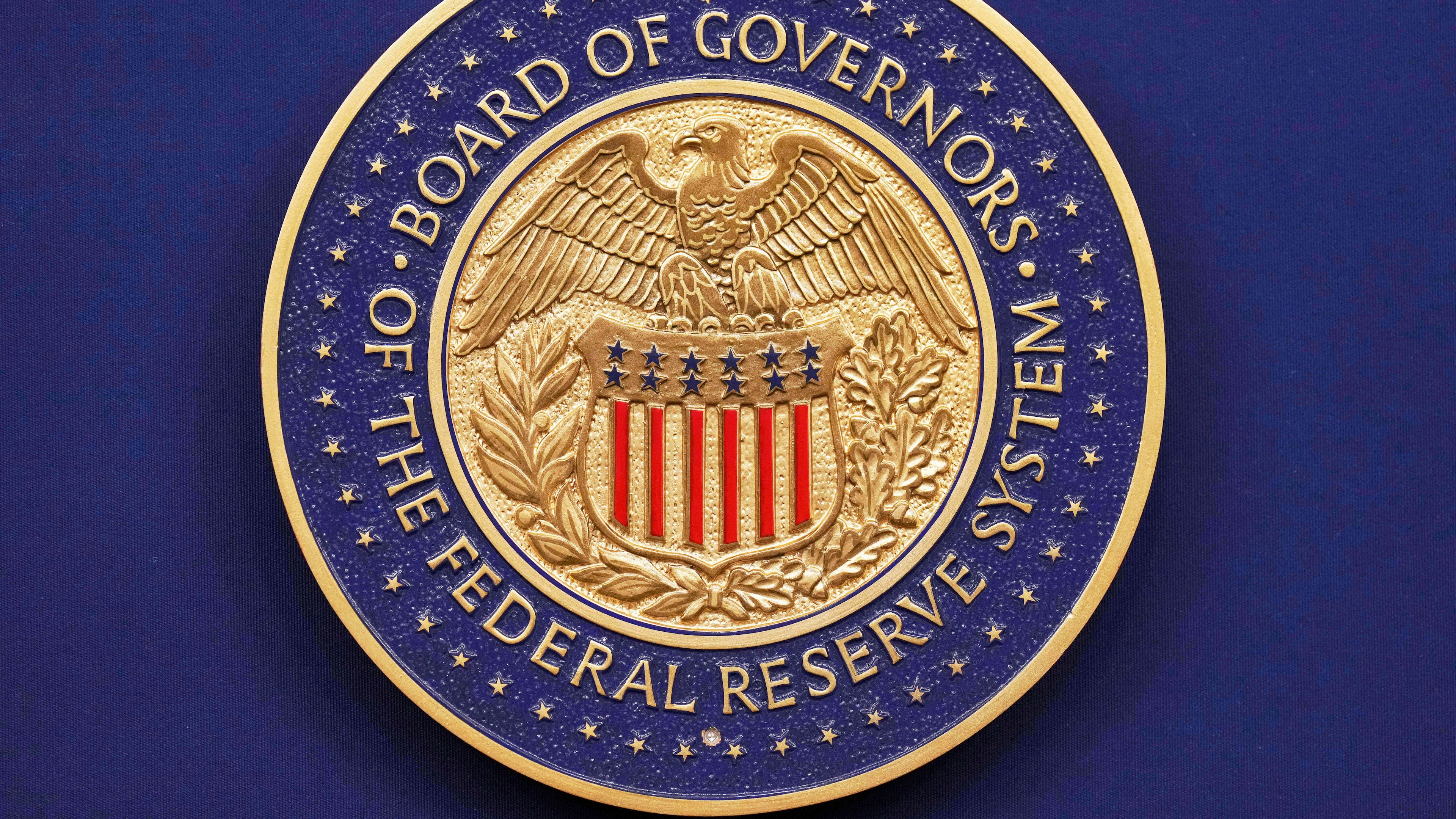 FILE - A seal is seen before Federal Reserve Chairman Jerome Powell walks out to speak during a news conference following the Federal Open Market Committee meeting, Wednesday, Sept. 17, 2025, at the Federal Reserve Board Building in Washington. (AP Photo/Jacquelyn Martin, file)