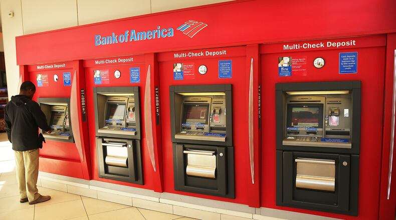 A man uses an ATM at a Bank of America branch in New York City.