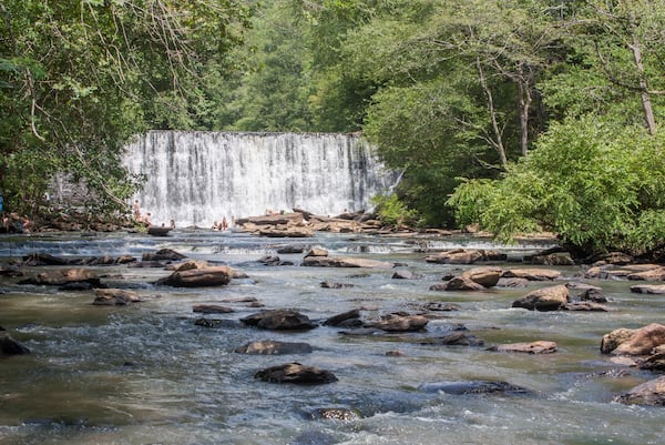 Although the dam that created Roswell Mill Waterfall is manmade, the sound and spray of the water and the reflection of leaves are nature's own. (Courtesy of city of Roswell)