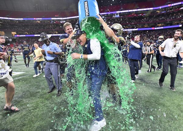 Georgia Tech head coach Geoff Collins is dunked with Gatorade by players after 45-22 win over North Carolina Saturday, Sept. 25, 2021, at Mercedes-Benz Stadium in Atlanta. (Hyosub Shin / Hyosub.Shin@ajc.com)