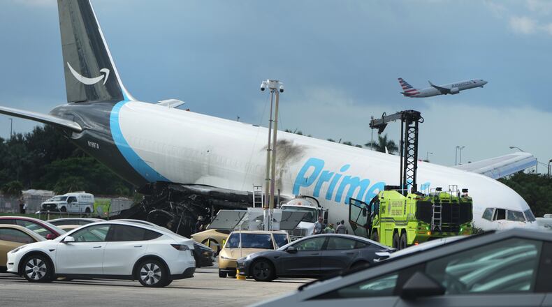 An Amazon cargo plane sits at the Miami International Airport (MIA) Monday, Sept. 7, 2026, after it overshot the runway on Sunday, in Miami. (AP Photo/Lynne Sladky)