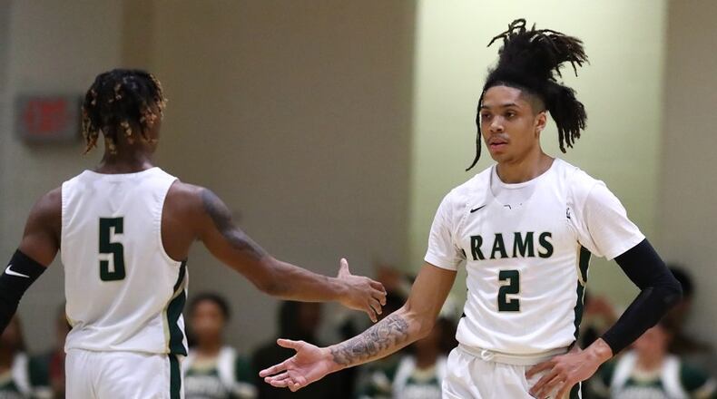 Grayson  guard Caleb Murphy (right) gets five from teammate Deivon Smith after scoring against Norcross in their Class AAAAAAA quarterfinal game at Grayson High School on Wednesday, Feb. 26, 2020, in Loganville. They’re the most celebrated guard pair in the state and lead the No. 1-ranked boys team in Class AAAAAAA. Curtis Compton ccompton@ajc.com