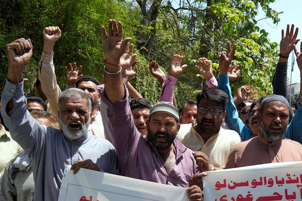Members of the Awami Rickshaw Union chant slogans during a demonstration against the suspension of water-sharing treaty by India with Pakistan, in Lahore, Pakistan, Sunday, April 27, 2025. (AP Photo/K.M. Chaudary)