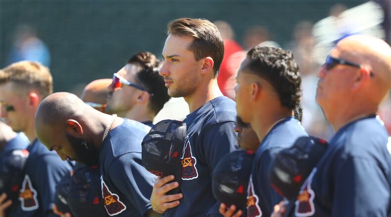 The Braves, including new first baseman Matt Olson (center) take the field for the national anthem to play the Minnesota Twins in thier first MLB preseason baseball game of the season on Friday, March 18, 2022, in North Port. “Curtis Compton / Curtis.Compton@ajc.com”