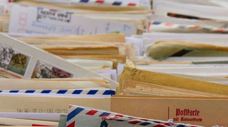 A former elementary school teacher stays in contact with former students by sending them letters and cards for their birthdays.