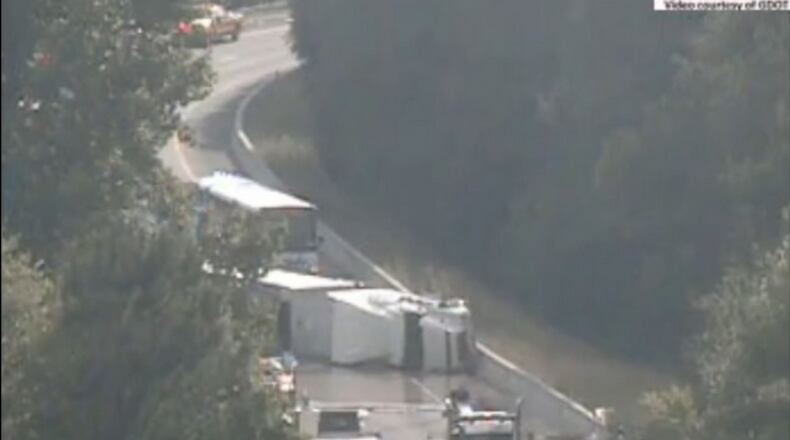 A tractor-trailer carrying about 40,000 pounds of liquid plastic overturned on I-285 southbound at Exit 46, the ramp to I-20 east.