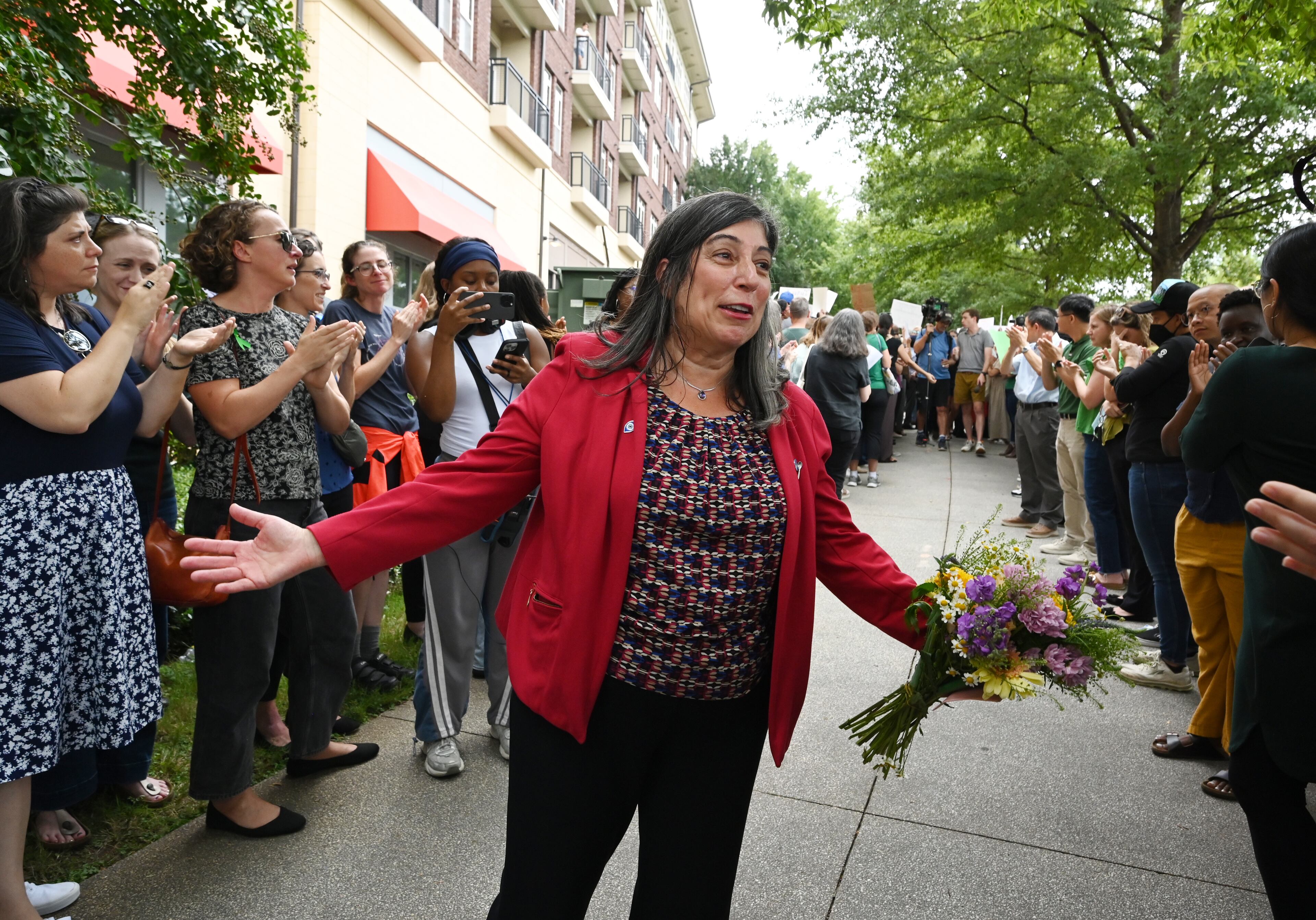 Dr. Debra Houry, the agency's deputy director, thanks to CDC staff and supporters gather to rally for departing leaders outside the CDC headquarters, Thursday, August 28, 2025, in Atlanta. Top leaders who resigned their positions at the US Centers for Disease Control and Prevention after the ouster of the agency’s director were escorted out of the building Thursday morning. (Hyosub Shin / AJC)