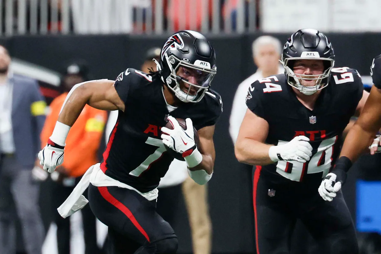 Falcons running back Bijan Robinson (center) run for yardage against the Saints on Sunday, Jan. 4, 2026. Robinson, who was voted All-Pro, had 366 touches for 2,298 yards and 11 touchdowns this season. (Miguel Martinez/AJC)