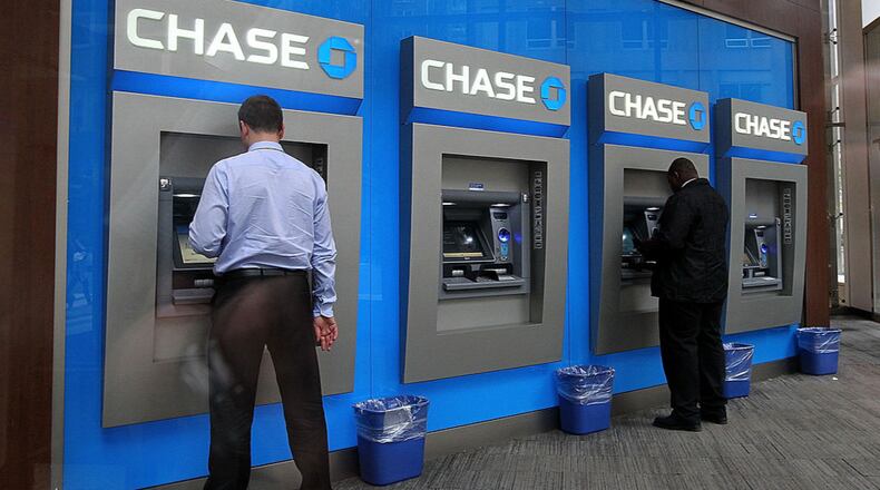 Bank customers use ATMs at a Chase Bank branch on May 14, 2012 in New York City. (Photo by Justin Sullivan/Getty Images)