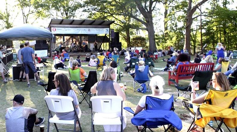 Residents enjoy live music at the Greenprints Alliance Trailfest 2016 in Woodstock. This year’s fund-raising event for the trail advocacy organization is May 6. GREENPRINTS ALLIANCE