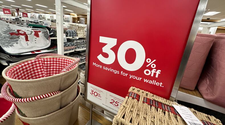 Sign shows discount available on seasonal items in a Kohl's department store, Monday, Dec. 8, 2025, in Castle Rock, Colo. (AP Photo/David Zalubowski)