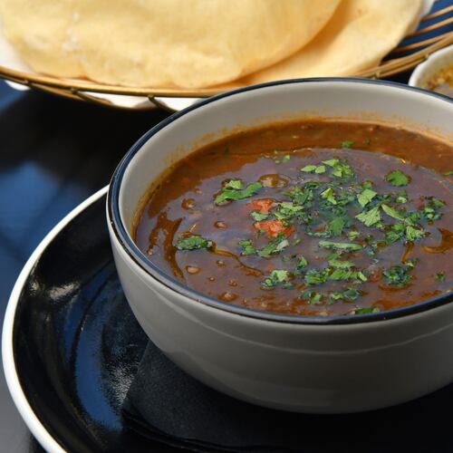 231017 Atlanta, Ga: Lentil Soup (served with house-made pita and olive oil with za’atar), from Zakia in Buckhead. For AAJC121023menu. (CHRIS HUNT FOR THE ATLANTA JOURNAL-CONSTITUTION)