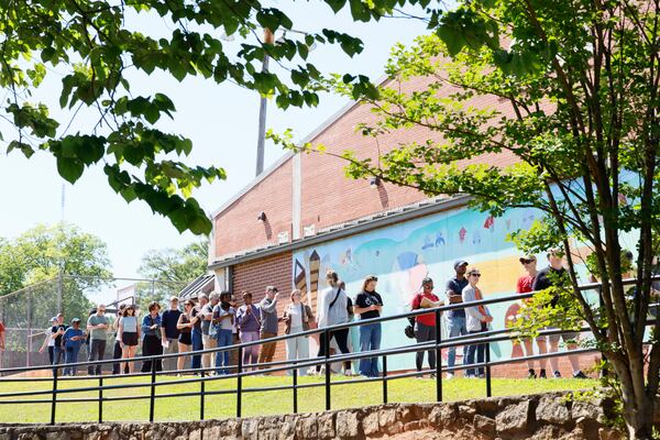 Dozens of people wait in line during the final day of early voting before Georgia's midterm primary elections on May 15. (Miguel Martinez/AJC)