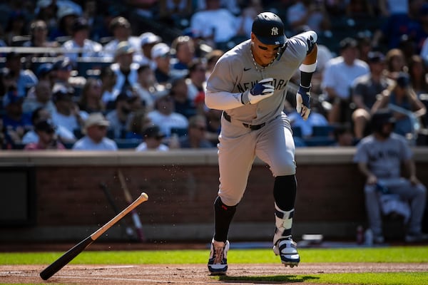 New York Yankees' Aaron Judge drops his bat after hitting a single during the first inning of a baseball game against the New York Mets, Saturday, July 5, 2025, in New York. (AP Photo/Angelina Katsanis)
