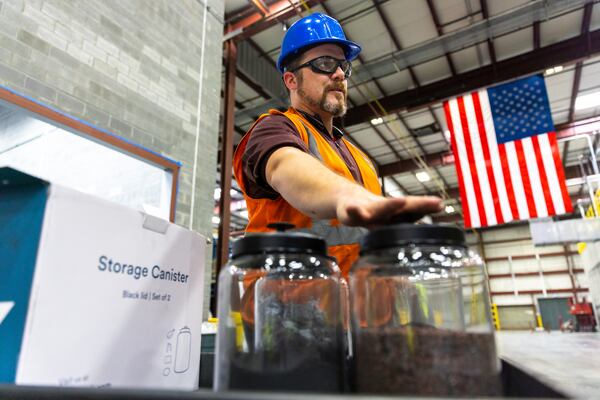 Quality manager Ian Steel shows black mass and incoming raw materials at Ascend Elements' facility in Covington. (Arvin Temkar/AJC 2023)