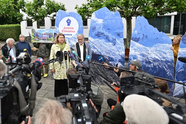 Lawyer Roda Verheyen speaks to journalists before the verdict is announced in the hearing of a climate lawsuit brought by Peruvian mountain farmer that glaciers above his hometown of Huaraz are melting due to German energy company RWE greenhouse gas emissions, at Hamm Higher Regional Court, in Hamm, Germany, Wednesday, May 28, 2025. (Bernd Thissen/dpa via AP)