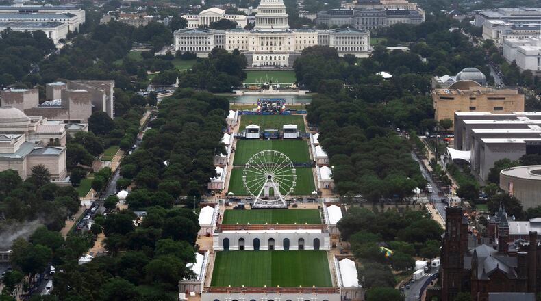 A Ferris wheel is seen on the National Mall for the 250 Anniversary celebration, Tuesday, June 23, 2026, in Washington. (AP Photo/Manuel Balce Ceneta)