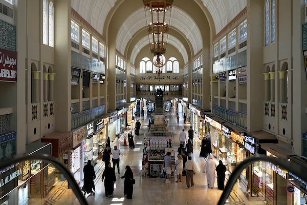 FILE - People shop for gold at a jewelry market in Dubai, United Arab Emirates, Wednesday, April 9, 2025. (AP Photo/Altaf Qadri, File)