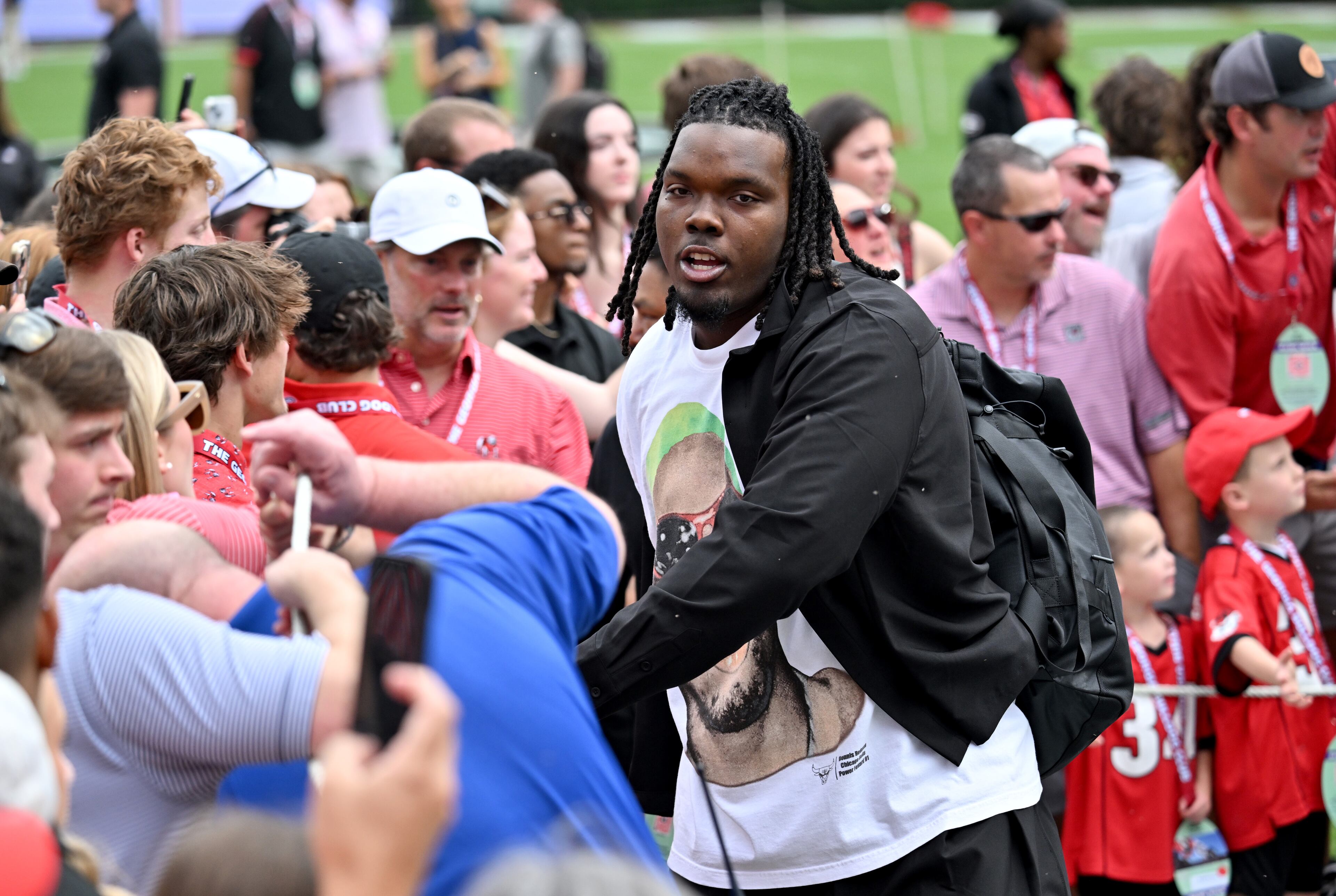Georgia defensive lineman Christen Miller and other players arrive during the Dawg Walk before an NCAA football game against Mississippi at Sanford Stadium, Saturday, October 18, 2025, in Athens. (Hyosub Shin/AJC)