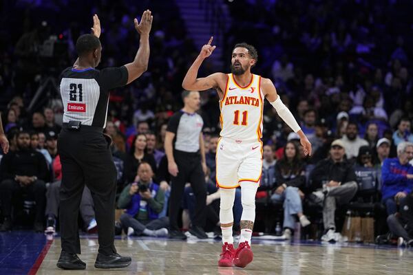 Atlanta Hawks' Trae Young reacts during the second half of an NBA basketball game against the Philadelphia 76ers, Friday, April 11, 2025, in Philadelphia. (AP Photo/Matt Rourke)