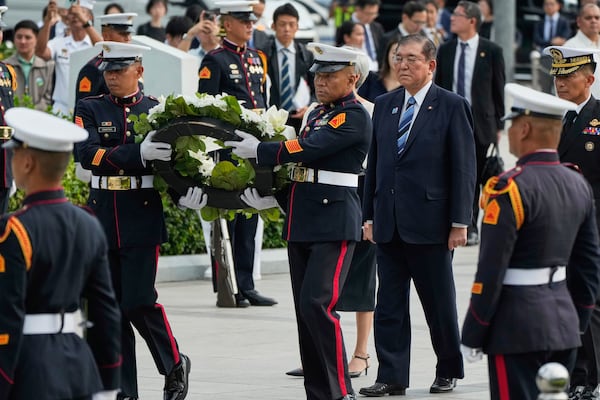 Japanese Prime Minister Shigeru Ishiba lays a wreath at the monument of Philippine National Hero Jose Rizal in Manila, Philippines on Tuesday, April 29, 2025. (AP Photo/Aaron Favila)