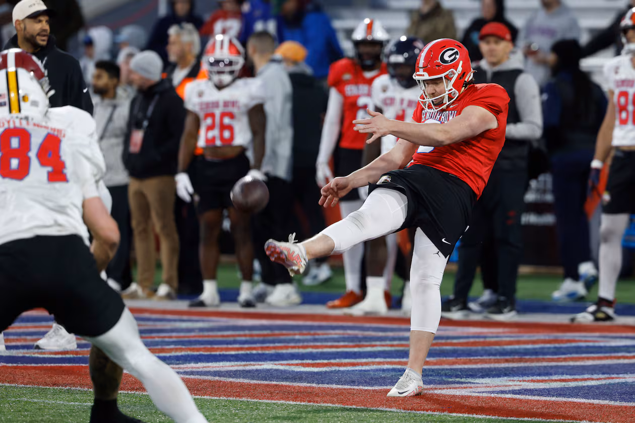 American team punter Brett Thorson (right) runs through drills during practice for the Senior Bowl on Tuesday, Jan. 27, 2026, in Mobile, Ala. Thorson is a former Georgia standout. (Butch Dill/AP)