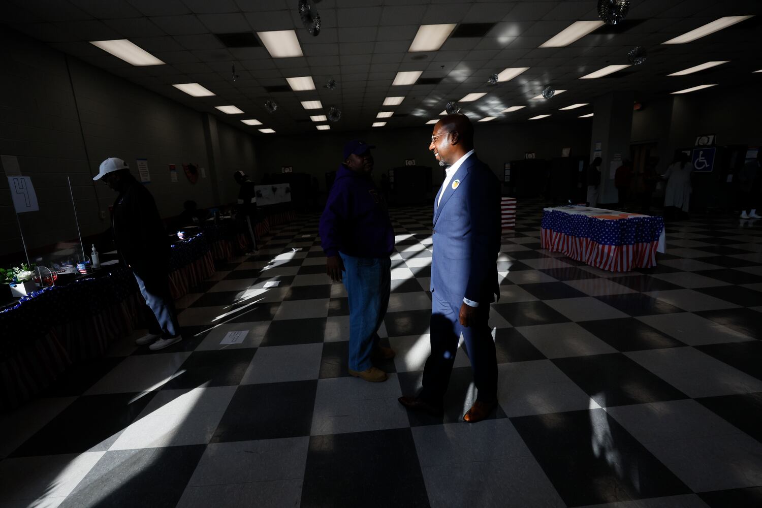 U.S. Senate Raphael Warnock walks inside of the C.T. Martin Rc Center after he cast his vote during the first day of early voting of the general elections on Monday, October 17, 2022, in Atlanta.Miguel Martinez / miguel.martinezjimenez@ajc.com