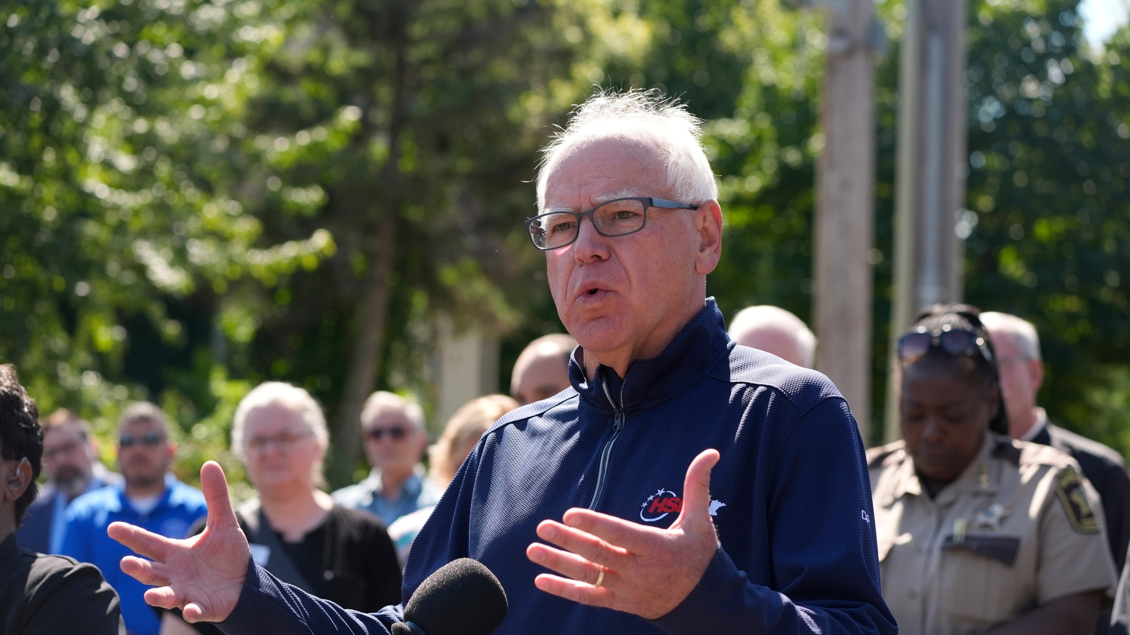 Minnesota Gov. Tim Walz speaks outside the Annunciation Catholic School following a shooting Wednesday, Aug. 27, 2025, in Minneapolis. (AP Photo/Bruce Kluckhohn)