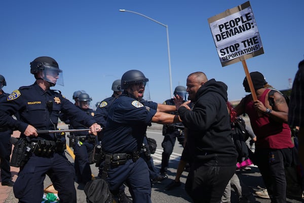California Highway Patrol officers clash with protesters on Tuesday, June 10, 2025, in Los Angeles. (AP Photo/Eric Thayer)