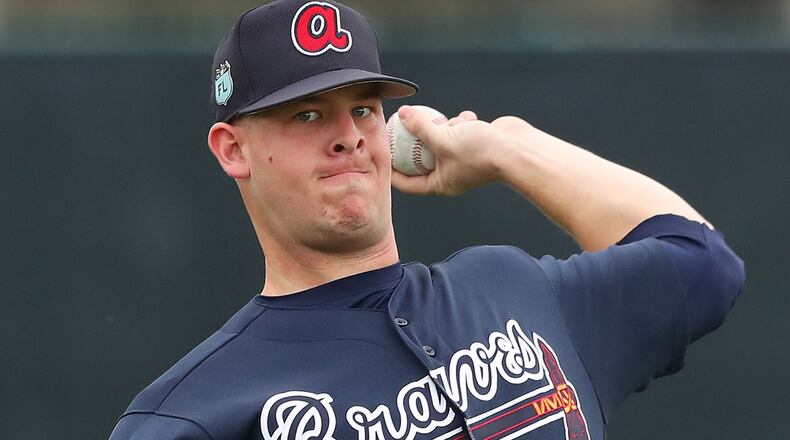 Atlanta Braves pitcher A.J. Minter throws to loosen up his arm during the first full squad workout on Saturday Feb. 18, 2017, at the ESPN Wide World of Sports in Lake Buena Vista, Fla.