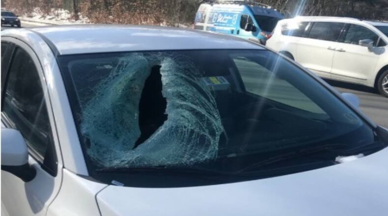A large piece of ice smashed into the windshield of a car traveling on a Massachusetts interstate.