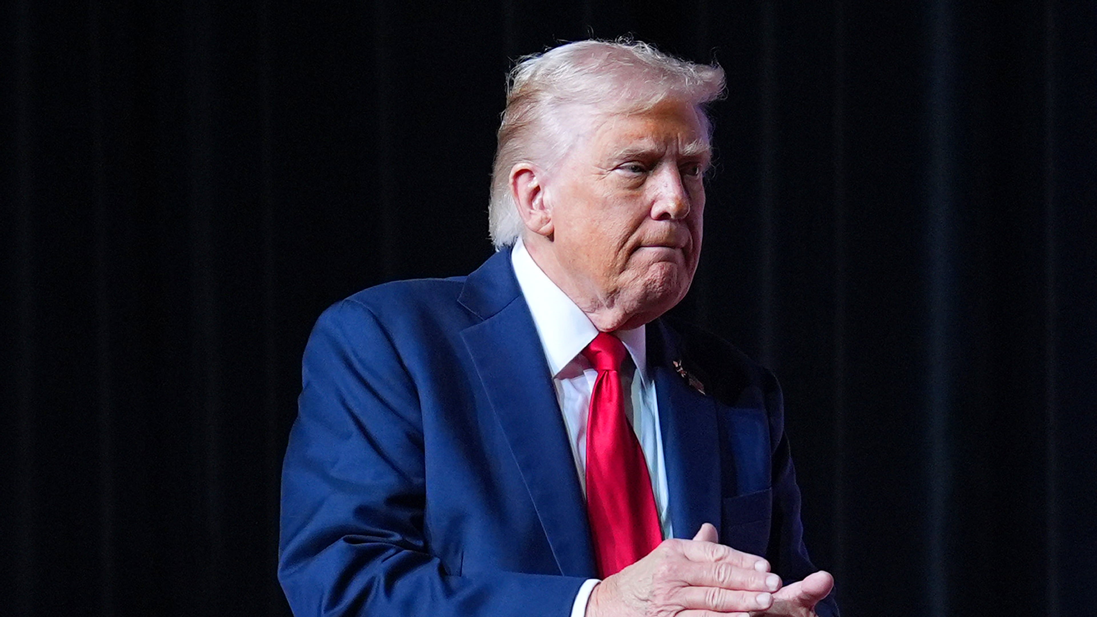 President Donald Trump walking off stage after speaking to a gathering of top U.S. military commanders at Marine Corps Base Quantico, Tuesday, Sept. 30, 2025, in Quantico, Va. (AP Photo/Evan Vucci)