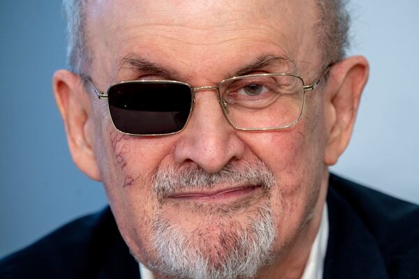 FILE - Author Salman Rushdie appears at a press conference at the Book Fair in Frankfurt, Germany on Oct. 20, 2023. (AP Photo/Michael Probst, File)
