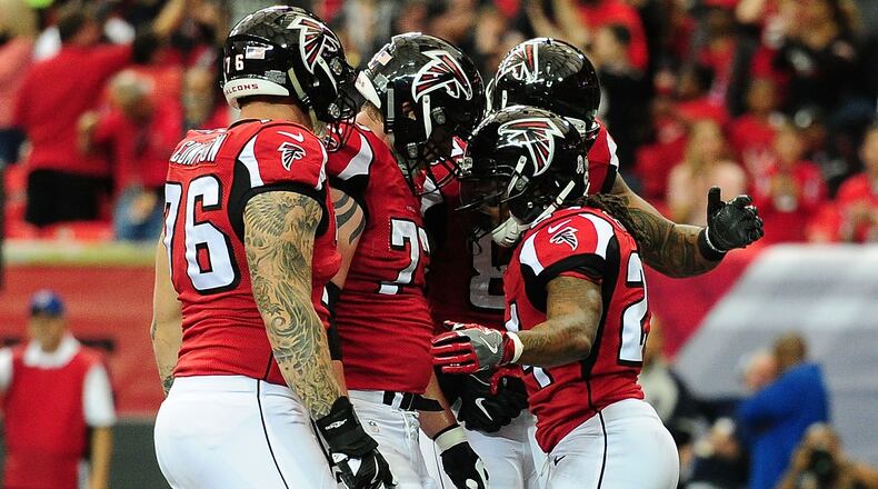 ATLANTA, GA - NOVEMBER 27: Devonta Freeman #24 of the Atlanta Falcons celebrates a touchdown during the first half against the Arizona Cardinals at the Georgia Dome on November 27, 2016 in Atlanta, Georgia. (Photo by Scott Cunningham/Getty Images)