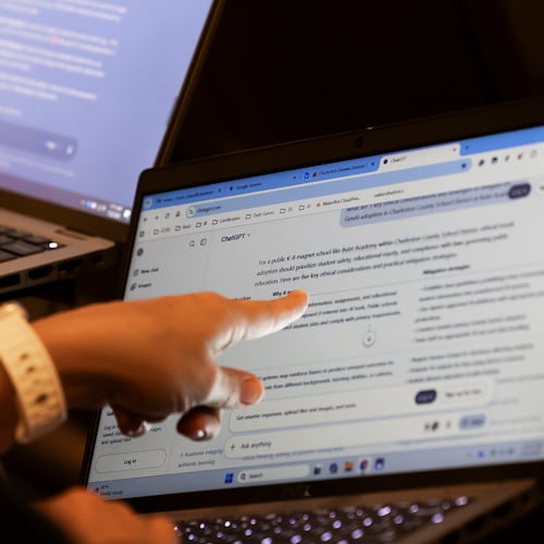 Teachers work with AI on their laptops during the Charleston County School District Charleston Educator Symposium Wednesday, July 22, 2026, in North Charleston, S.C. (AP Photo/Mic Smith)