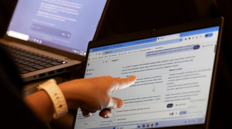 Teachers work with AI on their laptops during the Charleston County School District Charleston Educator Symposium Wednesday, July 22, 2026, in North Charleston, S.C. (AP Photo/Mic Smith)